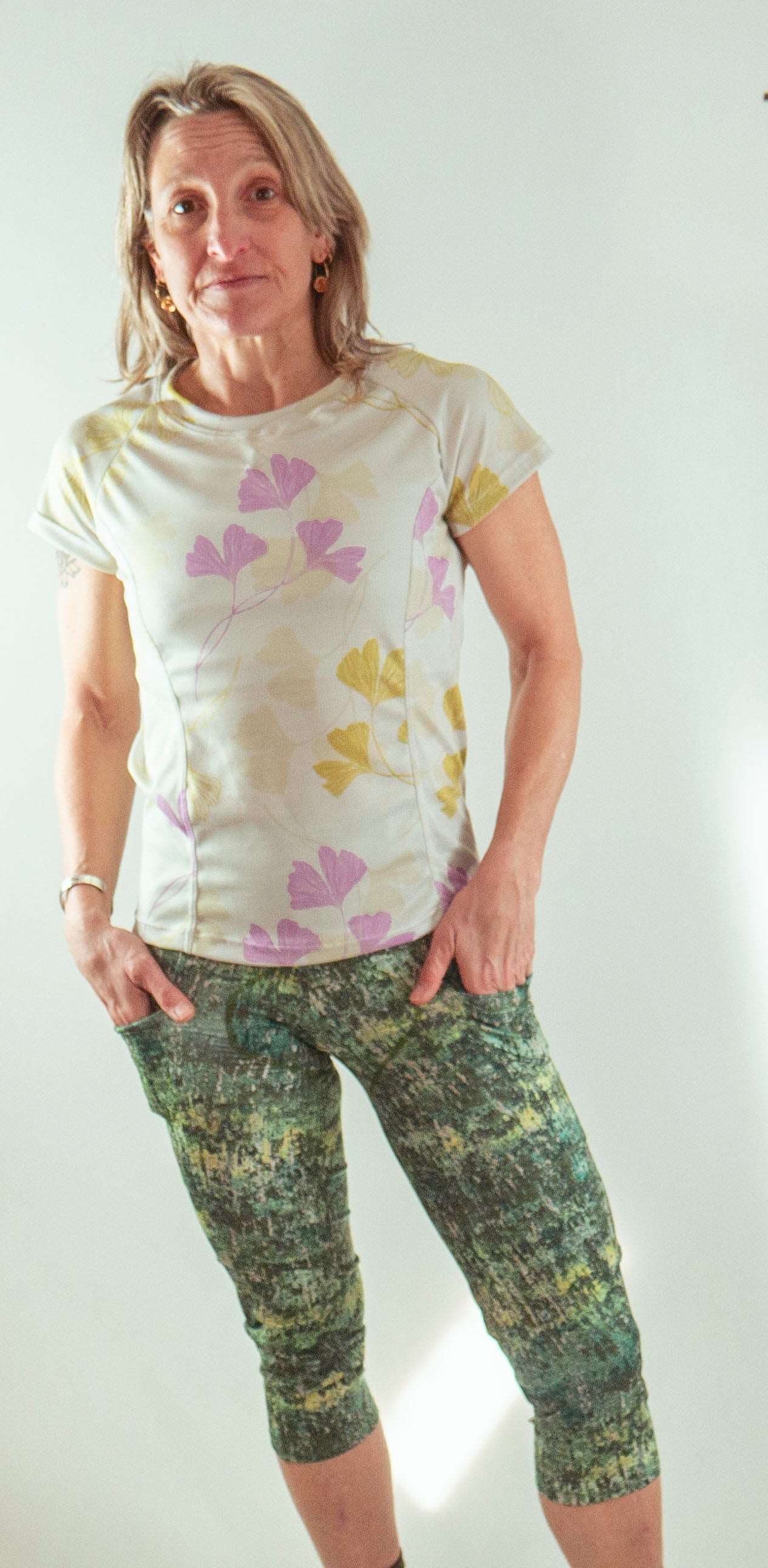 Moxie Tee jersey in moss floral design with moisture management fabric.